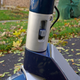 The hinge’s locking mechanism securely holds the handlebars in place.